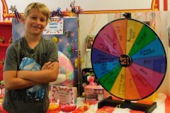 Happy boy in colorful hands-on learning area.